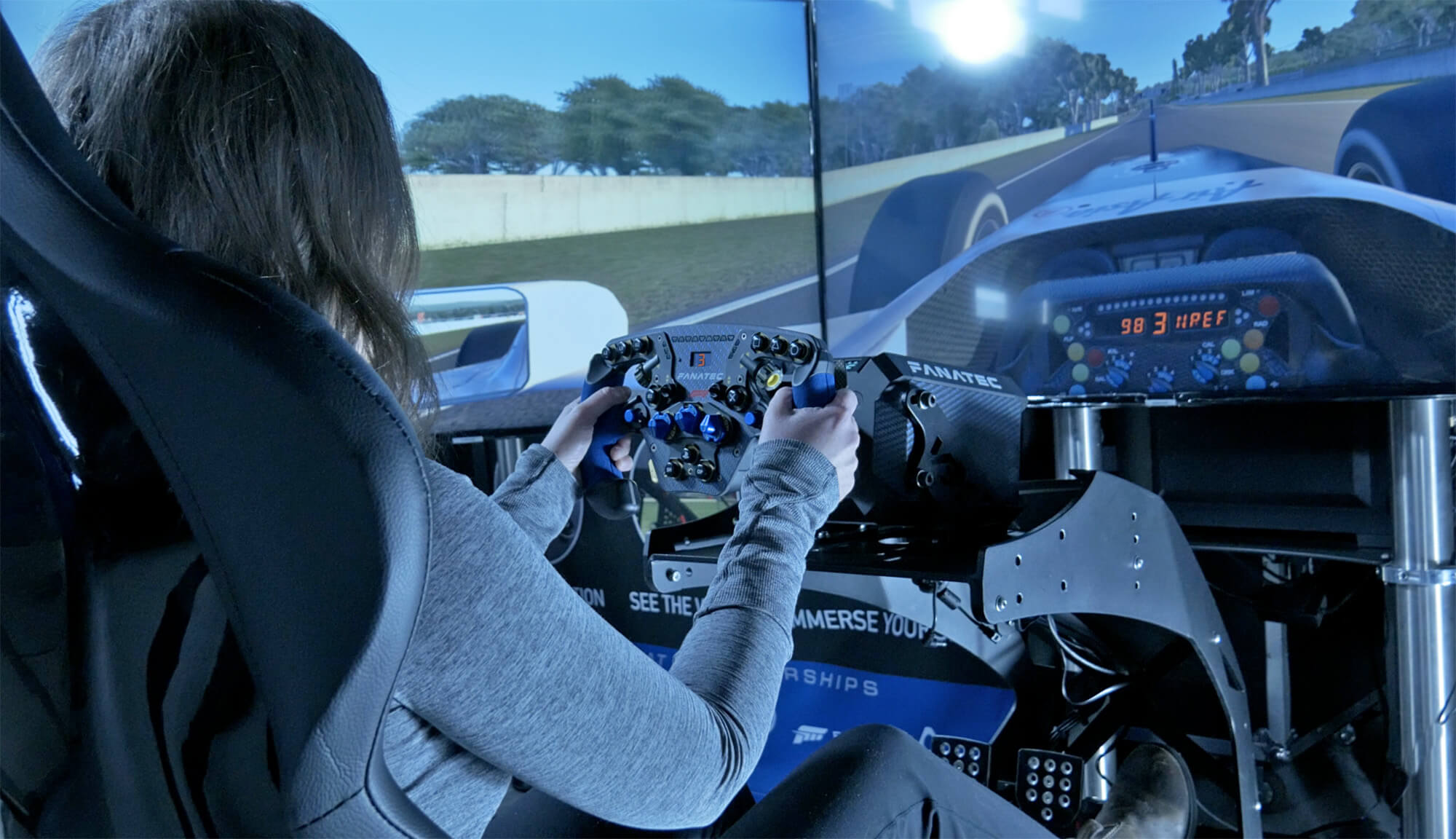 girl driving racing simulator